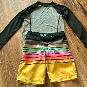 Boys rash guard and boys swim trunks.